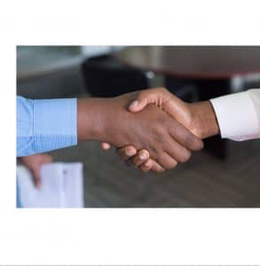 financial advisor shaking hands with a client